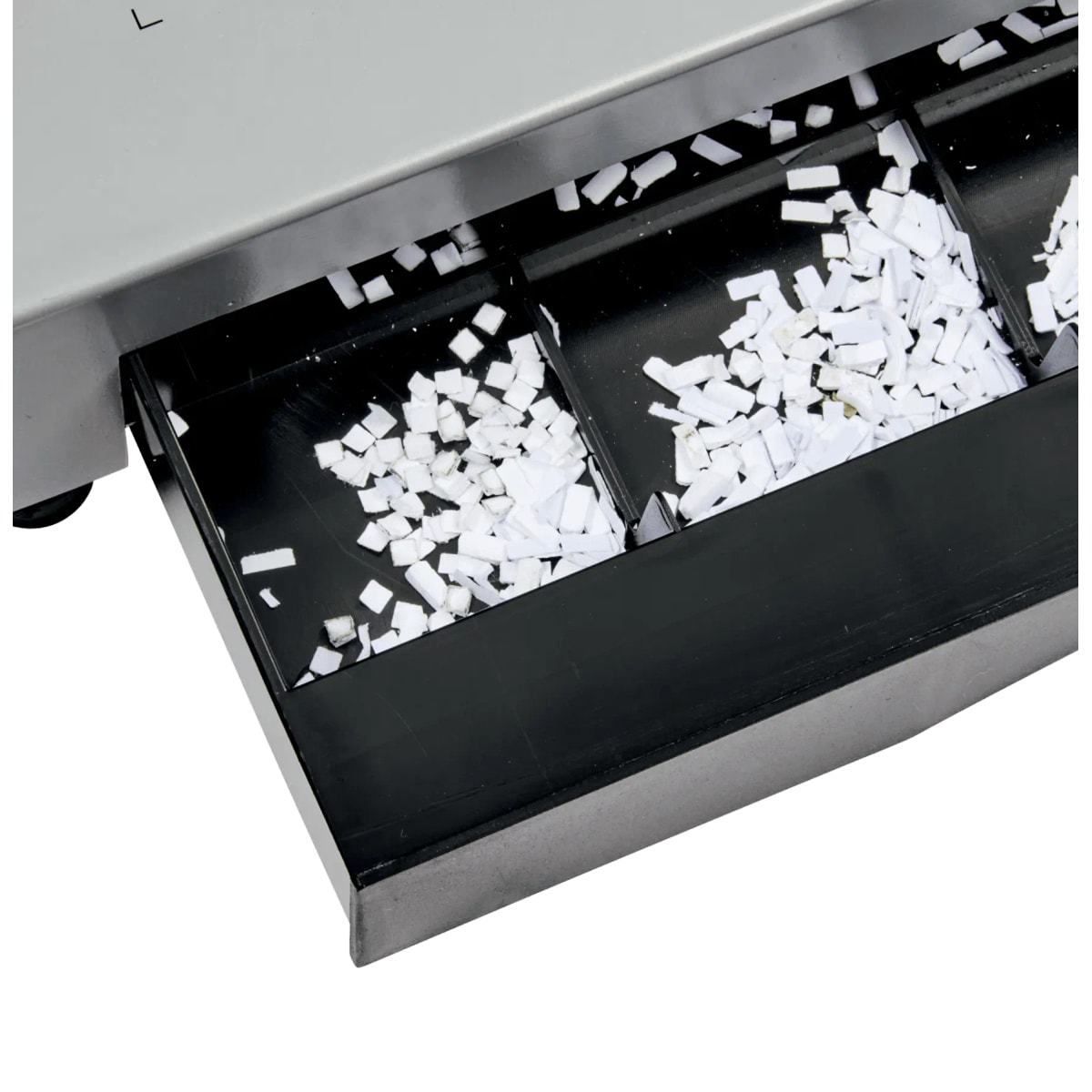 Bac à confettis ouvert de la perforelieuse électrique GBC CB25E Pro, après perforation.