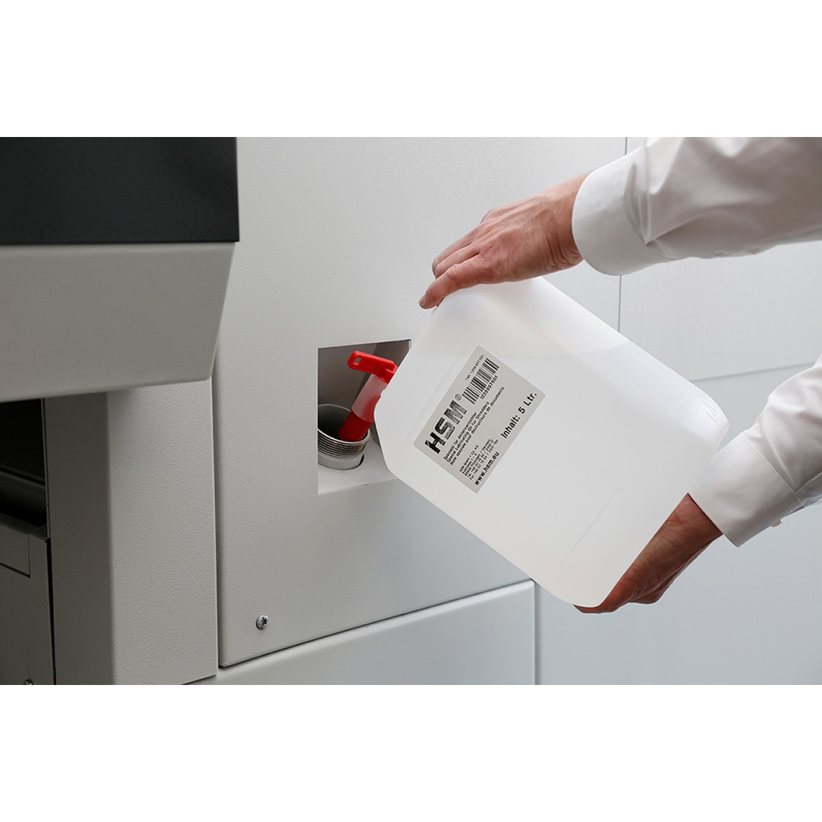 Remplissage du réservoir de l'huileur automatique de la combinaison HSM Powerline SP 5080